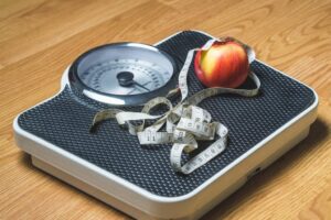 a scale with an apple and measuring tape best weight loss quotes