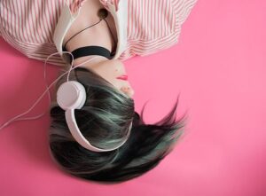 girl laying down listening to headsets music quotes
